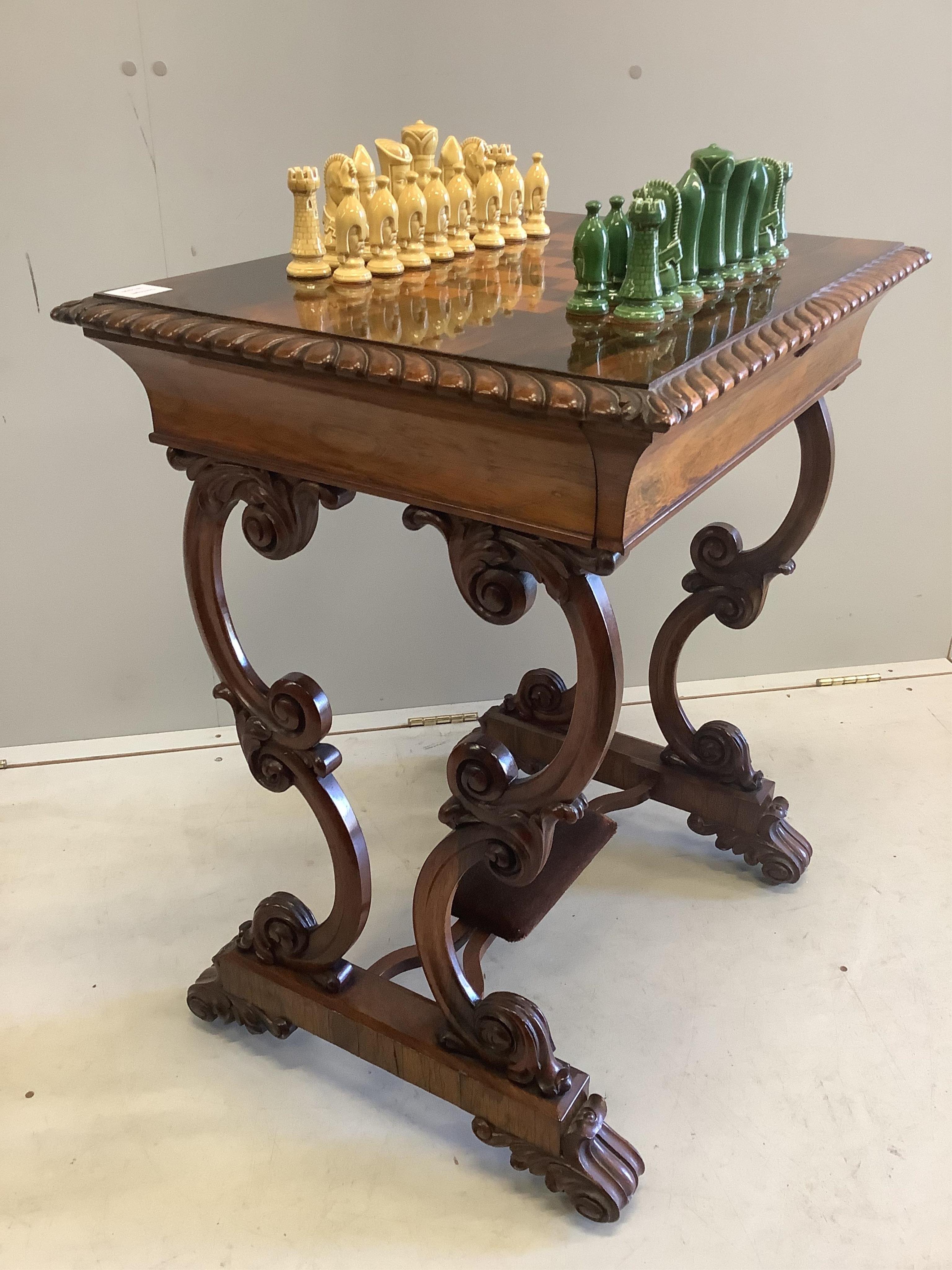 A Victorian rosewood chess top table, with chess pieces, width 66cm, depth 50cm, height 76cm